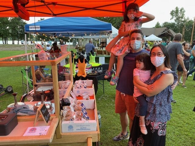 A happy family at the 3Bros Stroopwafel Baking Cart